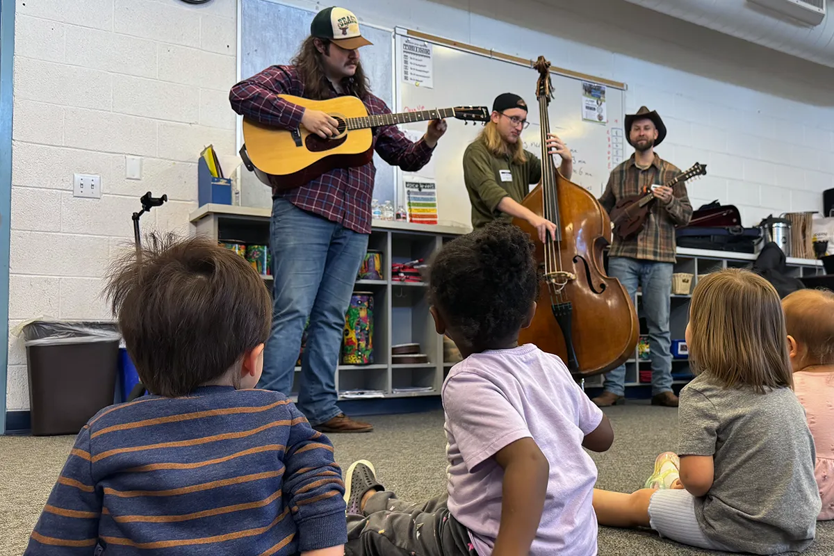 Summit preschool students experiencing live music with visiting musicians
