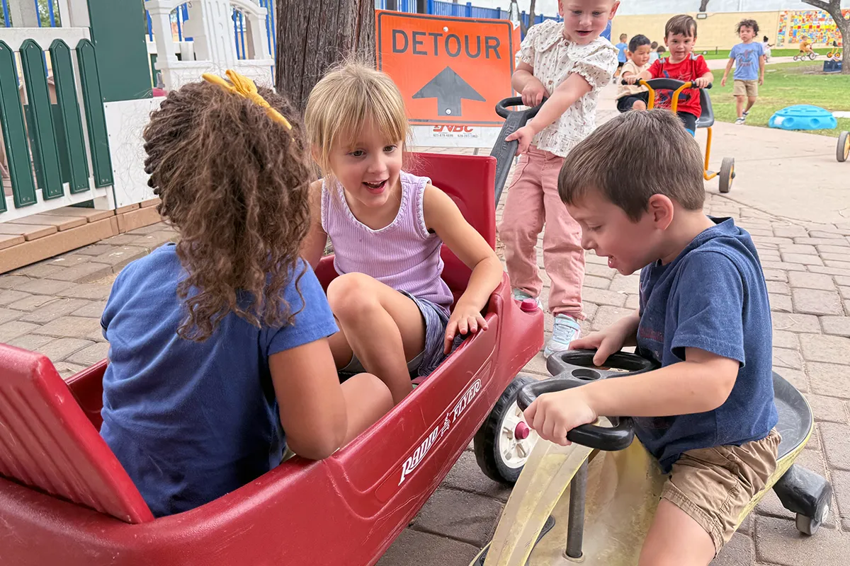 Summit School preschool students building friendships through cooperative outdoor play