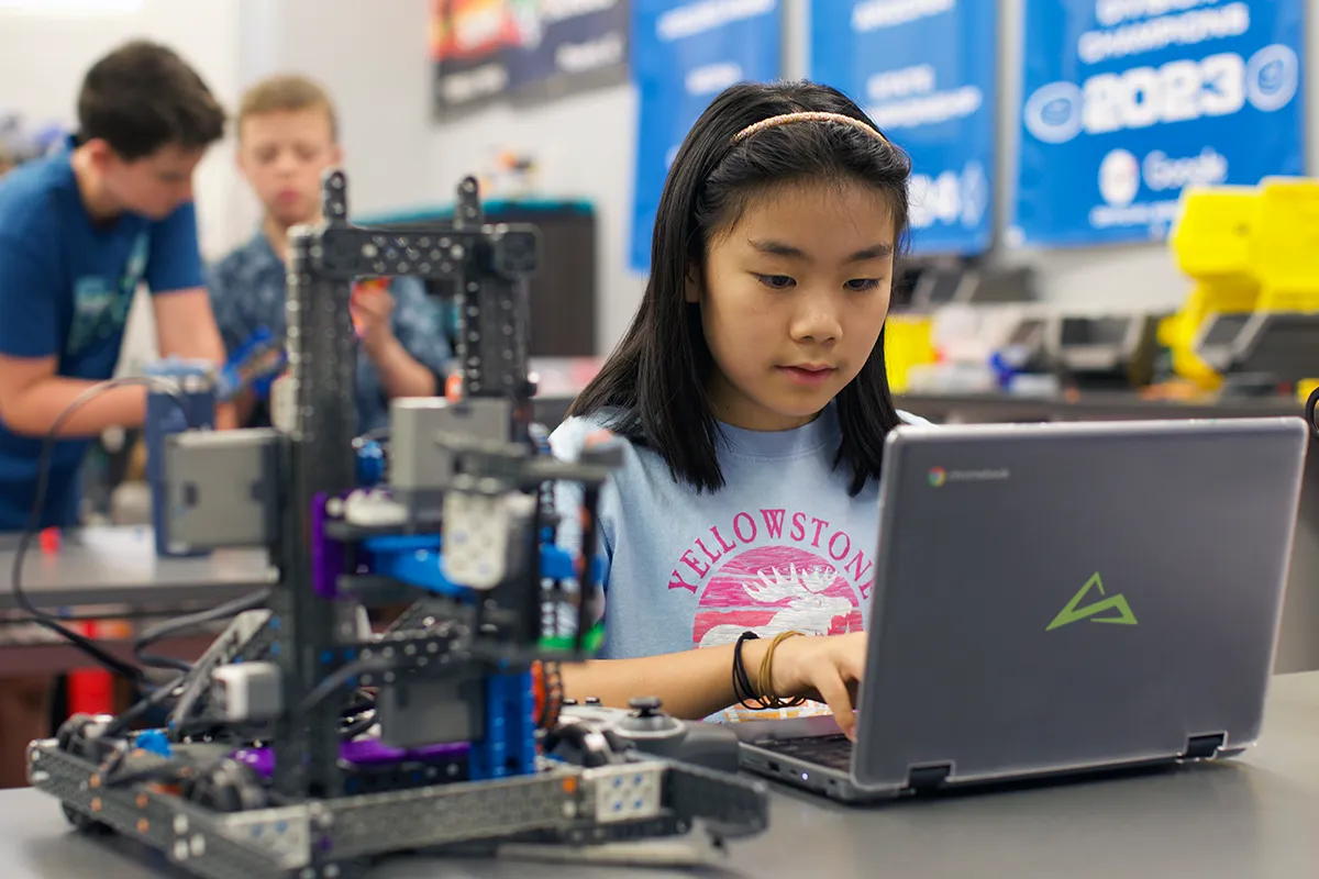 summit-school-ahwatukee-middle-school-robotics.webp School middle school student working on a robotics project with a computer.