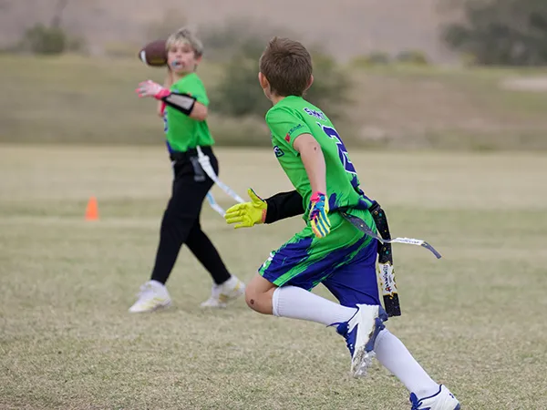 summit-school-ahwatukee-students-flag-football Summit School students playing flag football outdoors.
