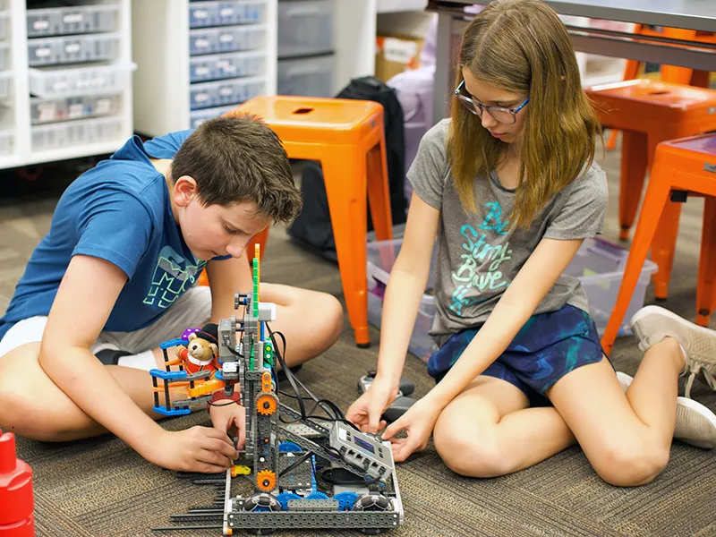 summit-school-ahwatukee-students-robotics-collaboration Summit School students collaborating on a hands-on robotics project.