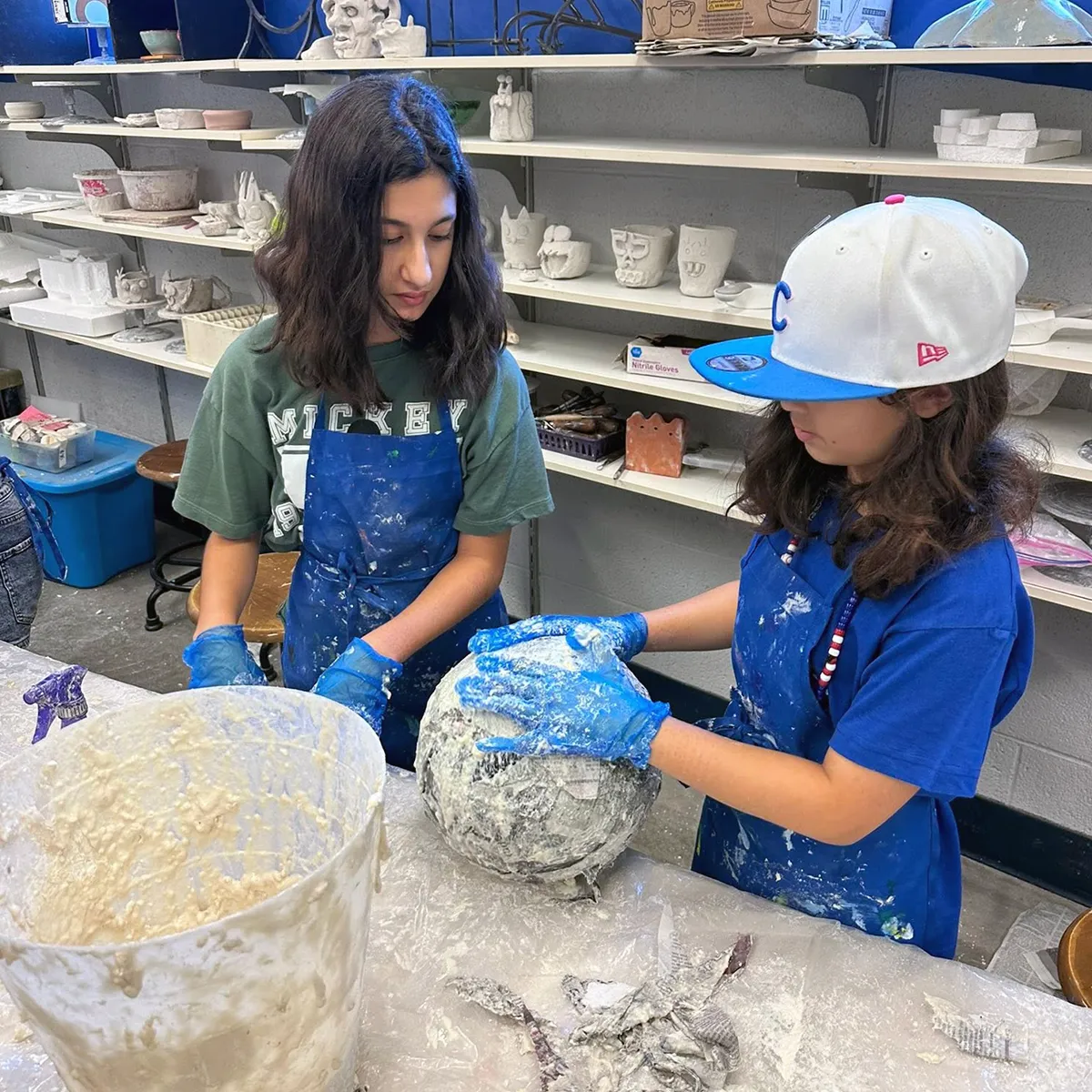 summit-middle-school-ceramics-elective Summit Middle School students working with clay during a ceramics elective.
