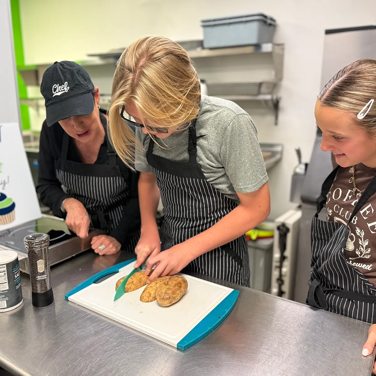 summit-middle-school-culinary-elective Summit Middle School student preparing food during a culinary elective.