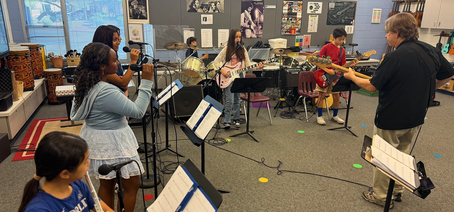 summit-middle-school-electives-rock-band-hero Summit Middle School students rehearsing together in a rock band elective.