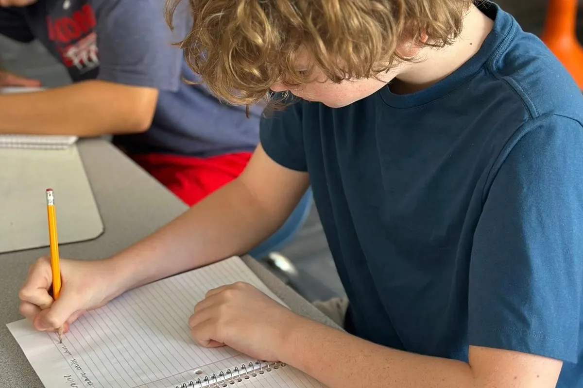Summit middle school student working on a writing assignment in English language arts.