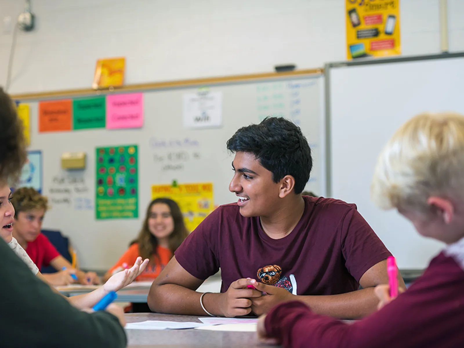 Summit middle school students collaborating during a classroom discussion.