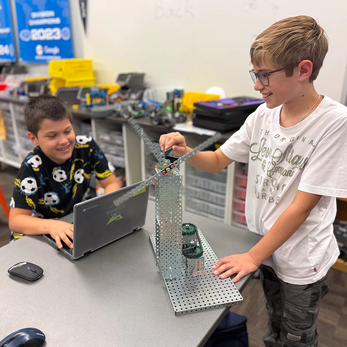 Summit middle school students building and testing an engineering project.