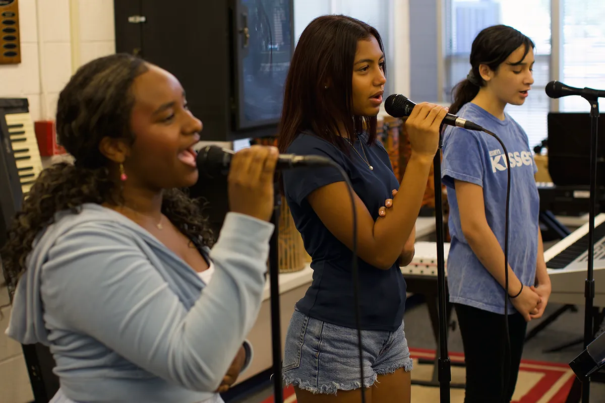 summit-middle-school-students-music-individual-growth Summit middle school students developing their skills during a music class.