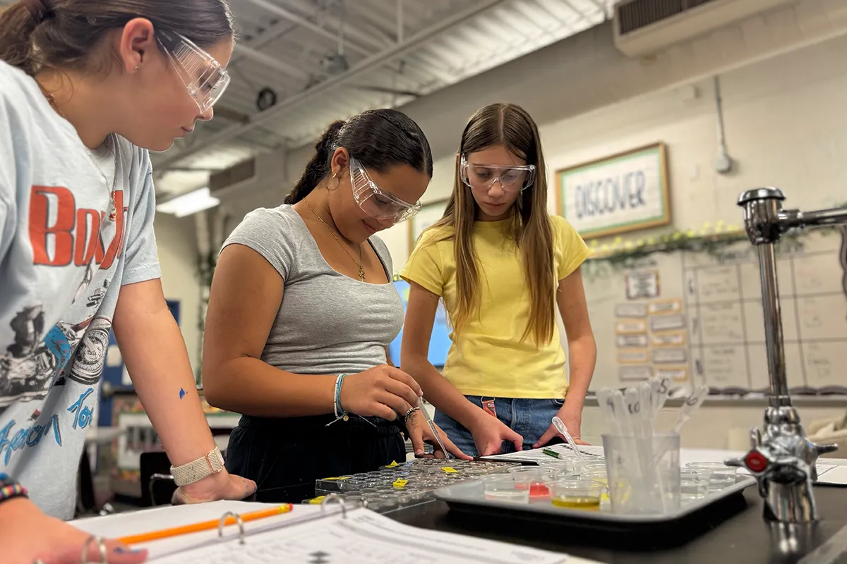 Summit middle school students conducting a hands-on science lab investigation.