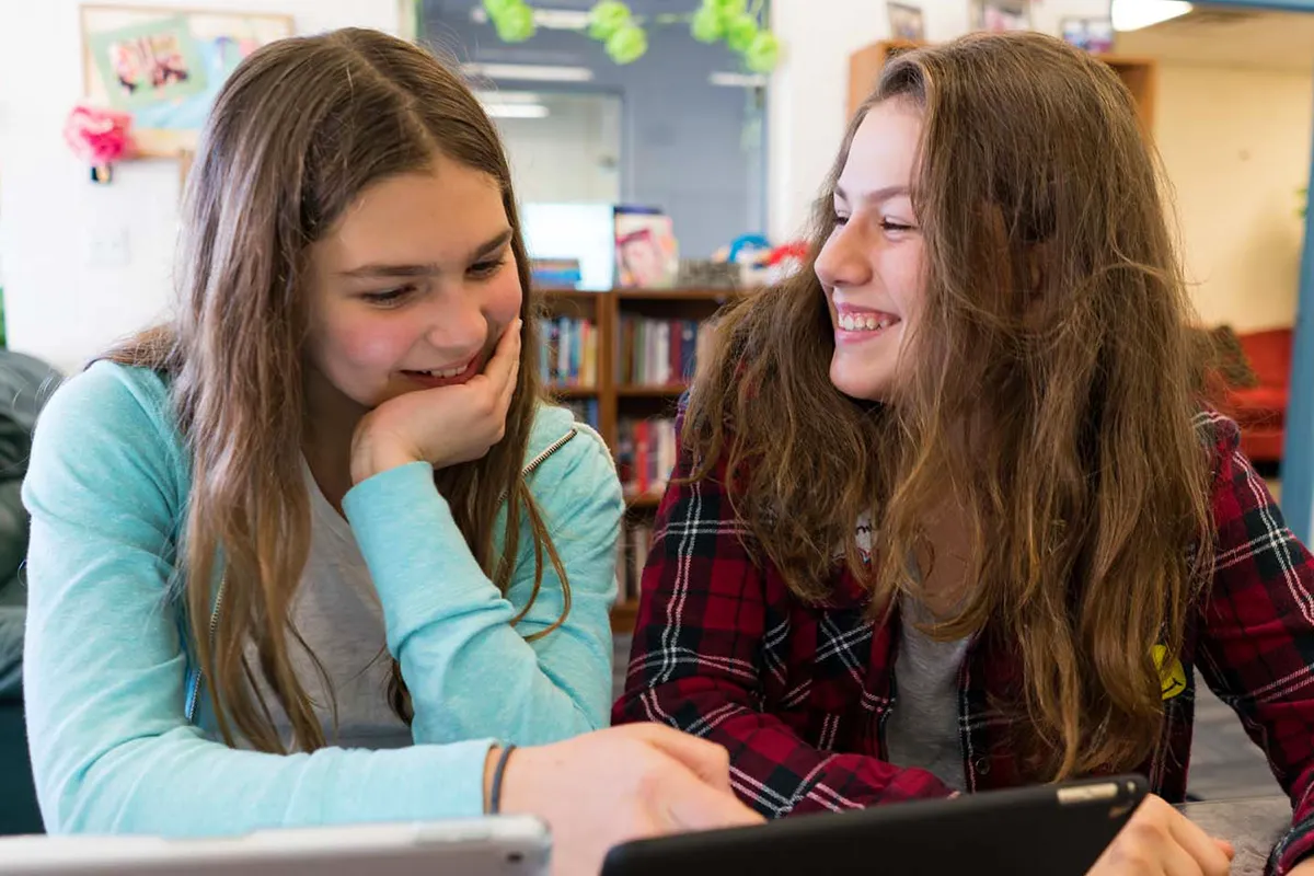 Summit middle school students collaborating during a social studies class.