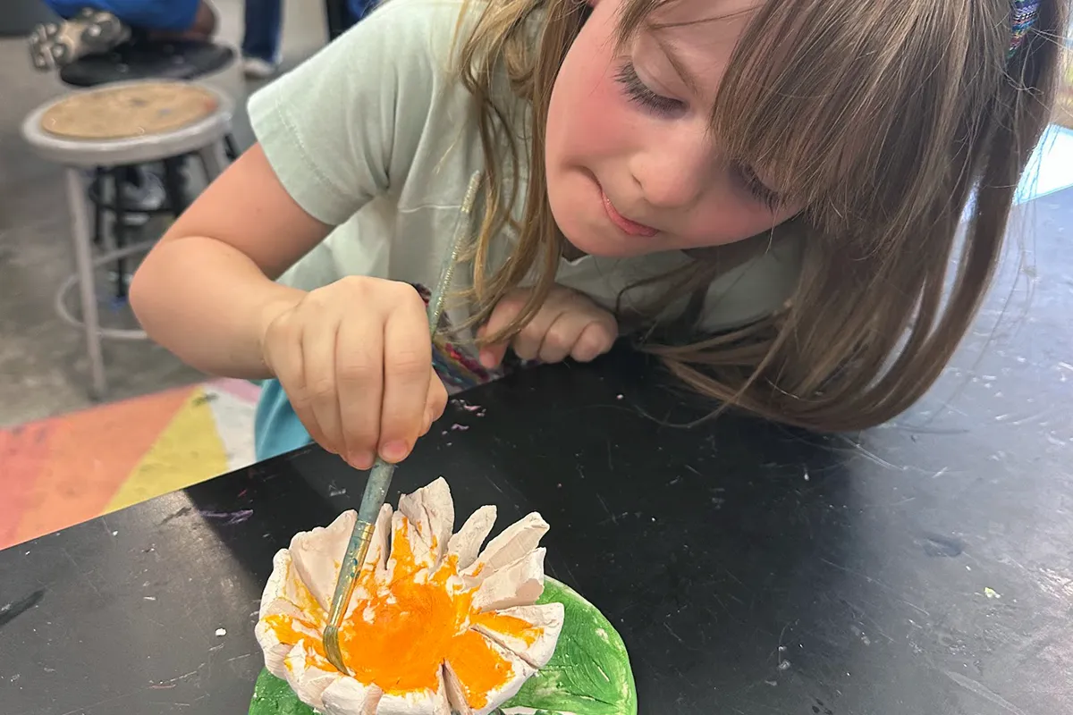 summit-school-after-school-art-enrichment Summit student painting an art project during after-school enrichment.