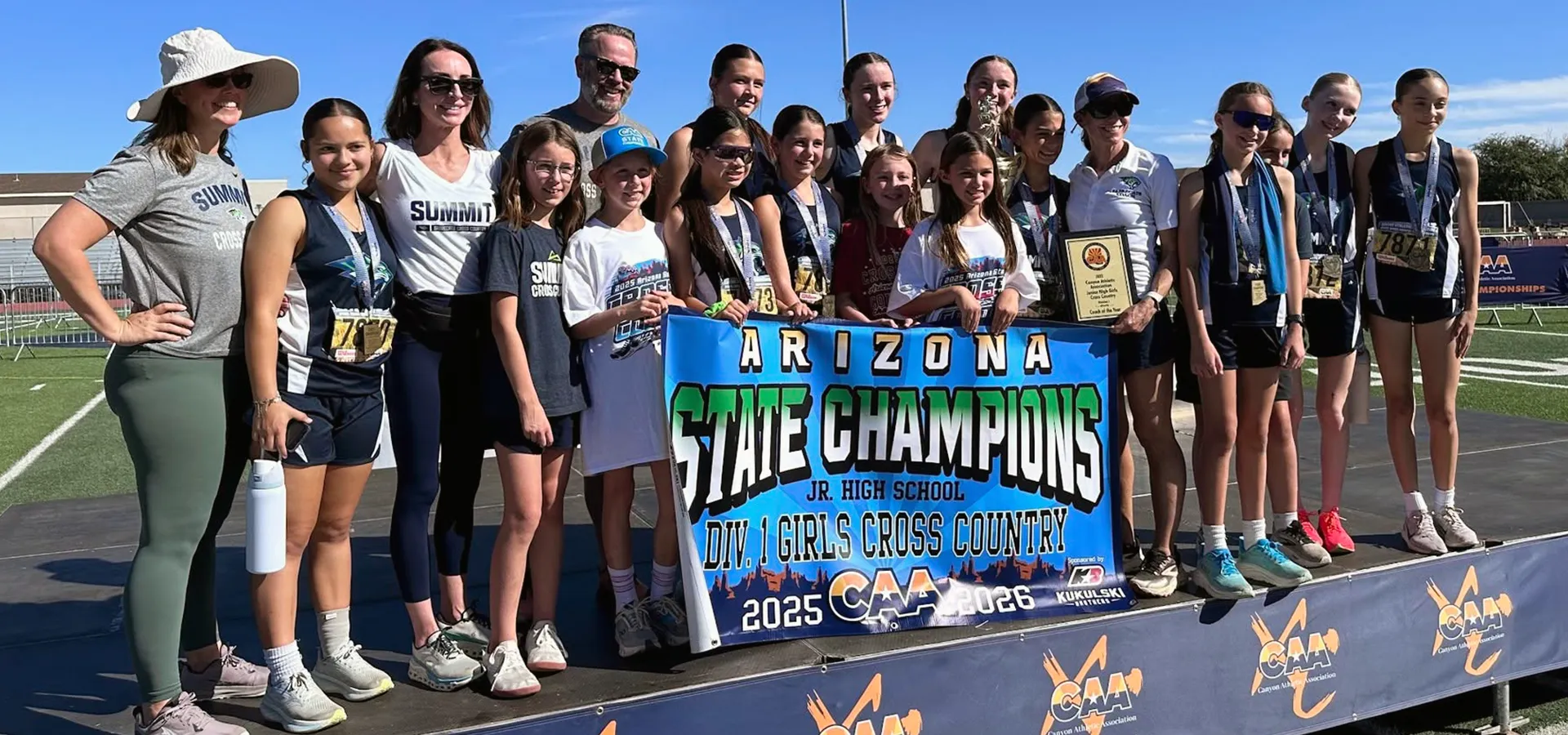 summit-school-athletics-championship-celebration Summit School athletes celebrate a championship moment in cross country.