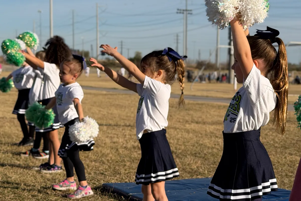 summit-school-cheer-team-routine Summit School cheerleaders perform a routine showing teamwork and school spirit.