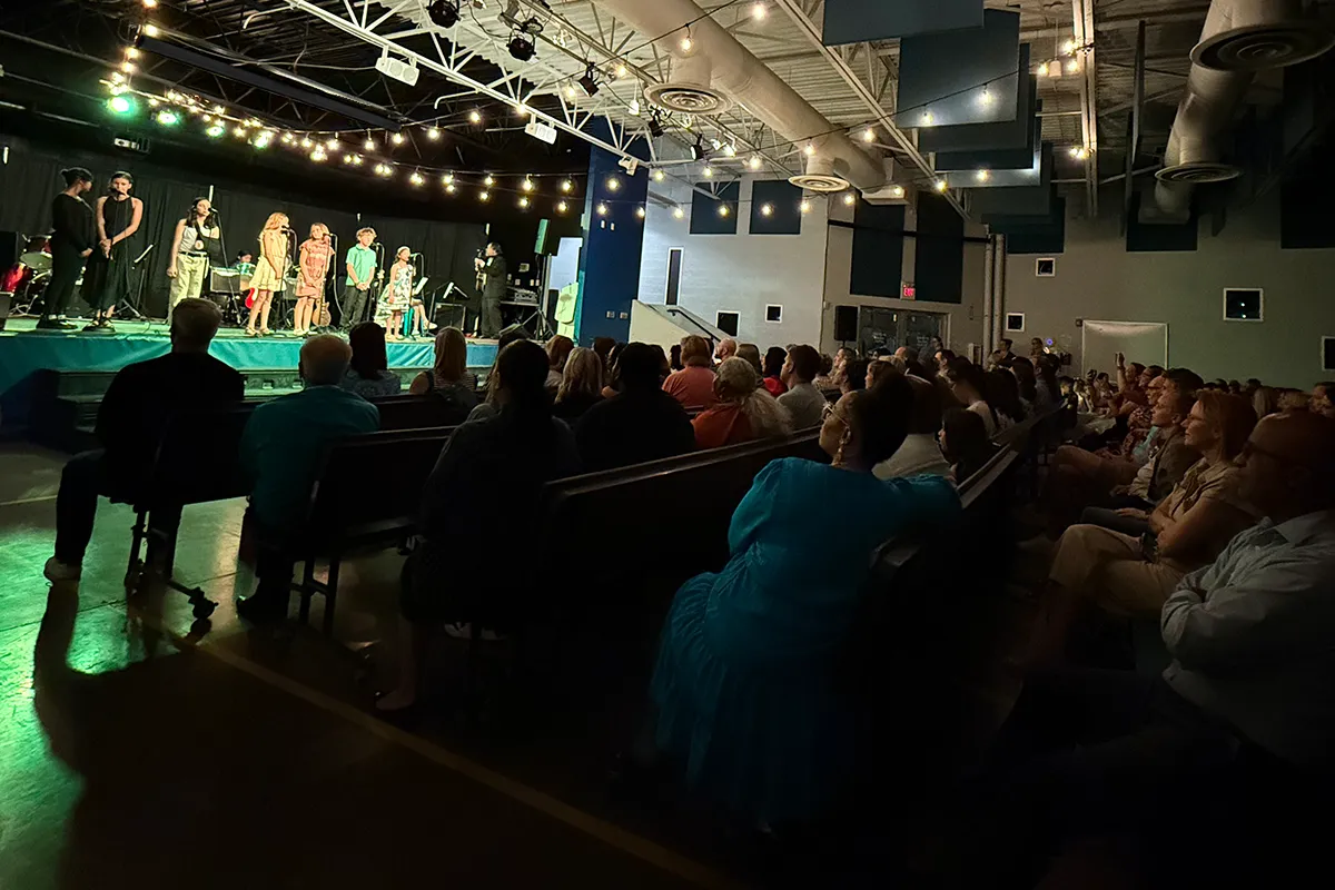 summit-school-community-performance Summit students performing on stage for families and the school community.