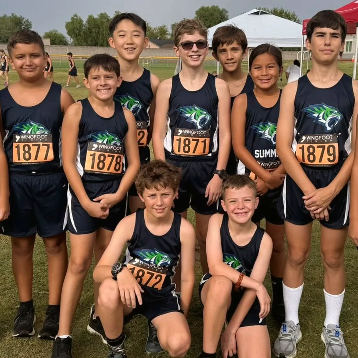 summit-school-cross-country-team Summit cross country runners together at a school meet.