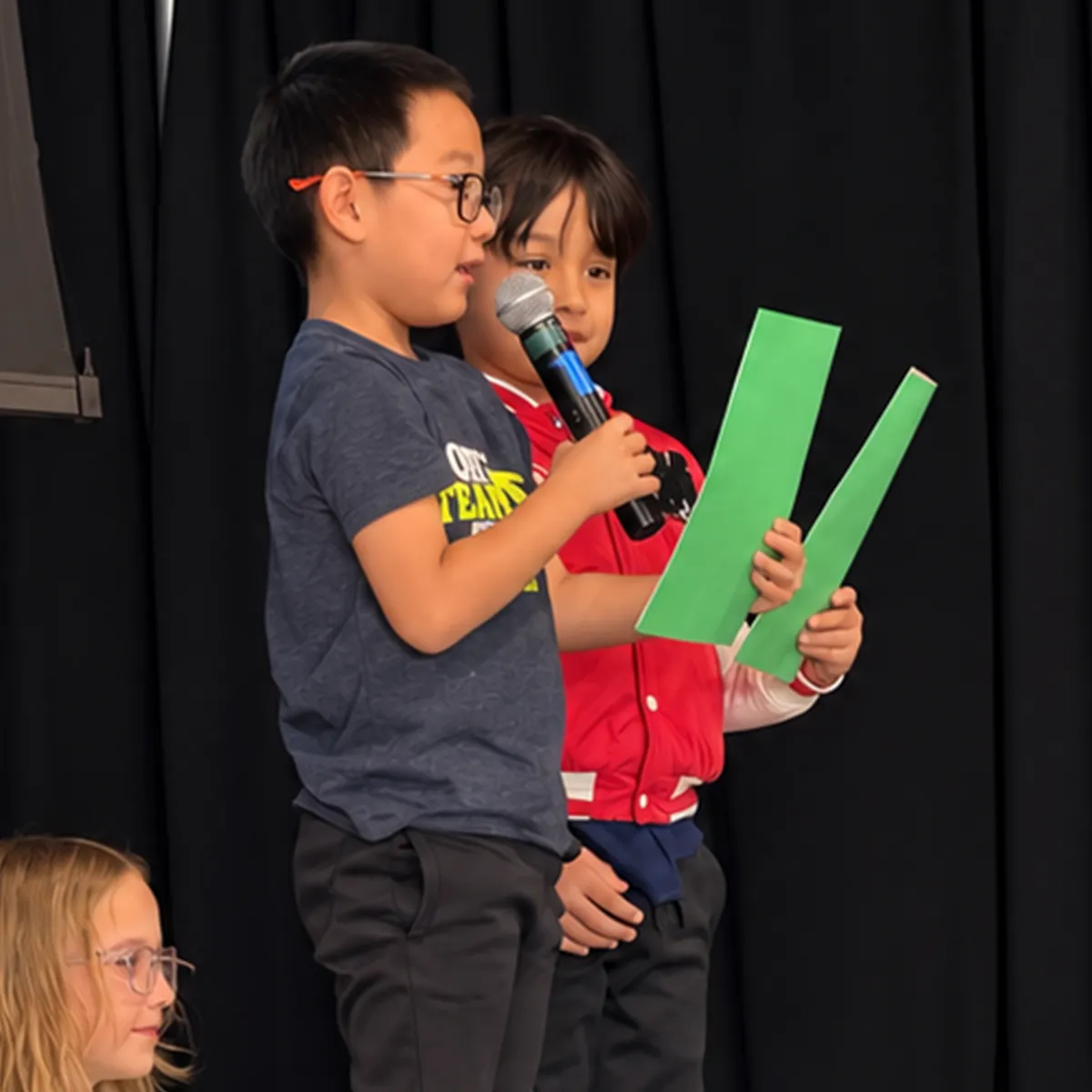 summit-school-morning-meeting-practice-public-speaking Summit School students practice public speaking by presenting to their peers during Morning Meeting.