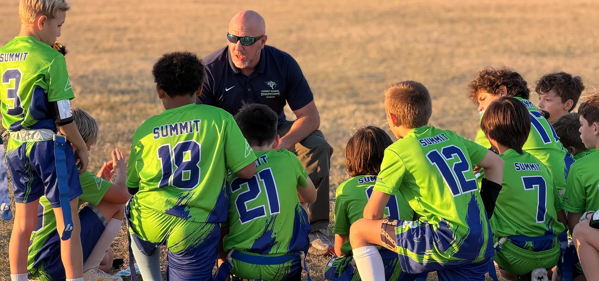 summit-school-phoenix-athletics-team-huddle Summit School athletes huddle together during a competitive sports game in Phoenix.