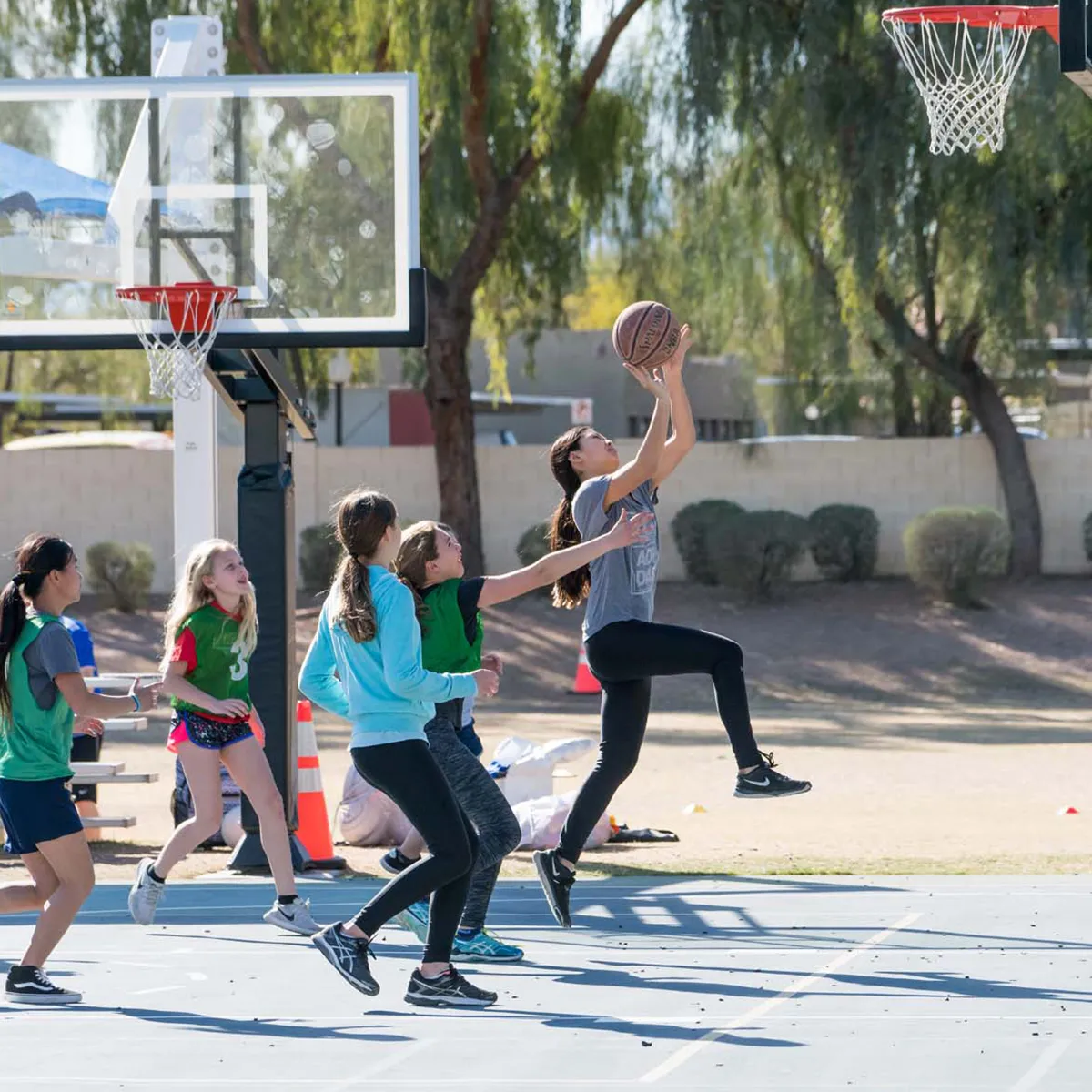 summit-school-physical-education-basketball Summit students playing basketball together during physical education.