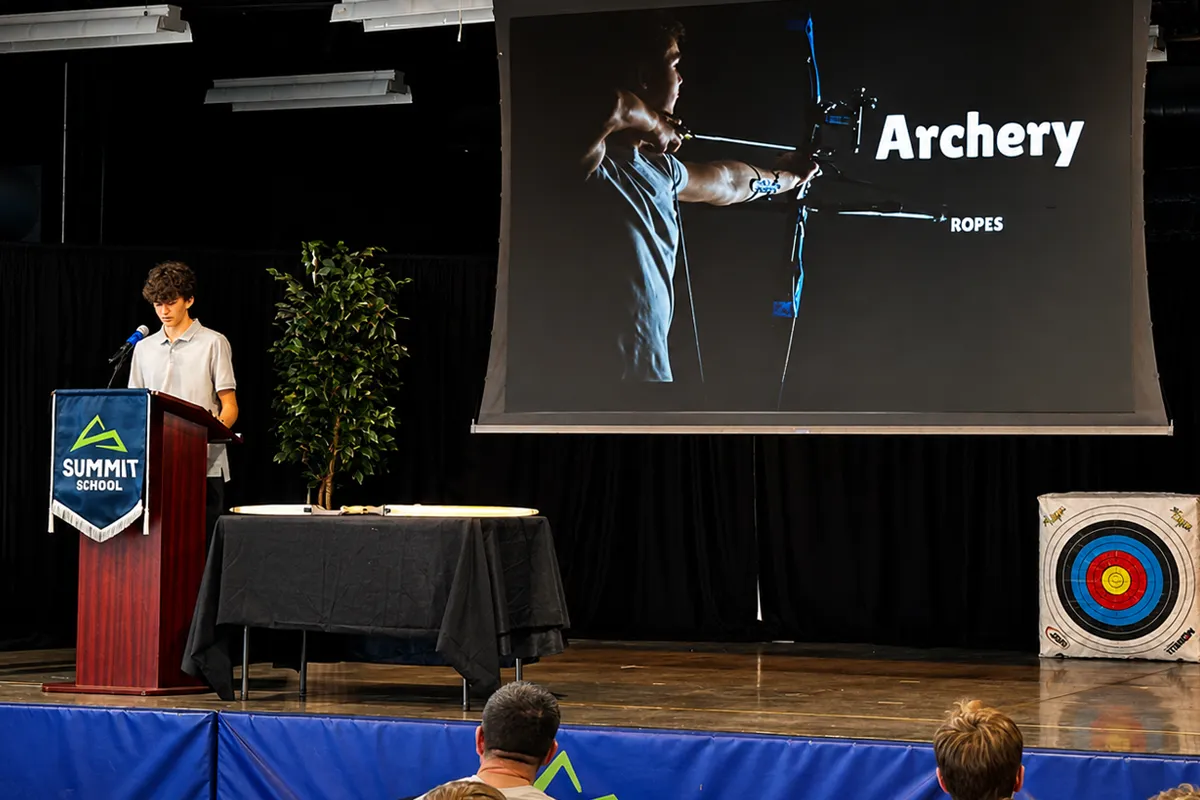 Summit School eighth-grade student presenting his ROPES project on archery.