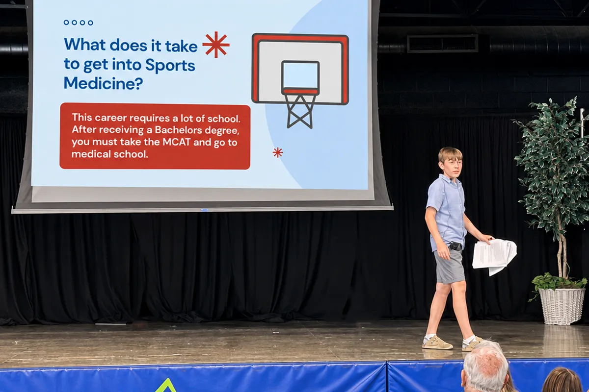 Summit School eighth-grade student presenting his ROPES project on sports medicine.