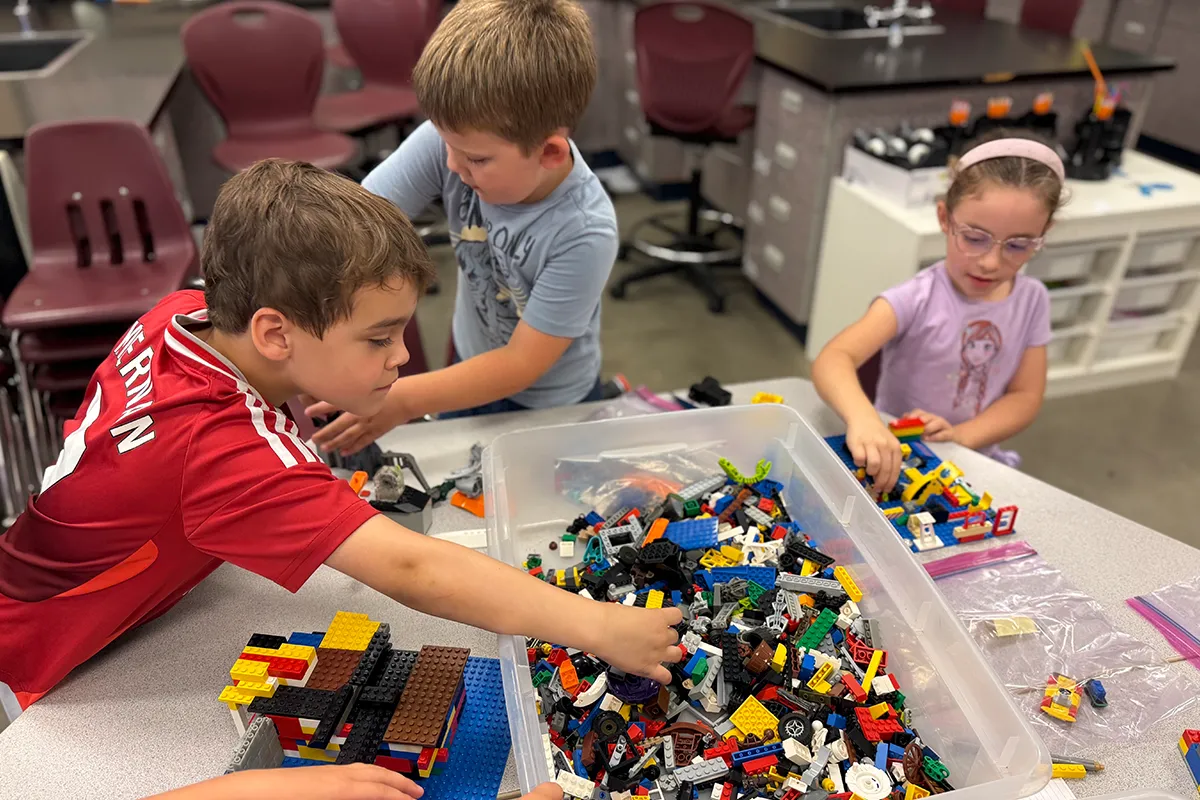 summit-school-students-building-legos Summit students building and playing with LEGO bricks together.