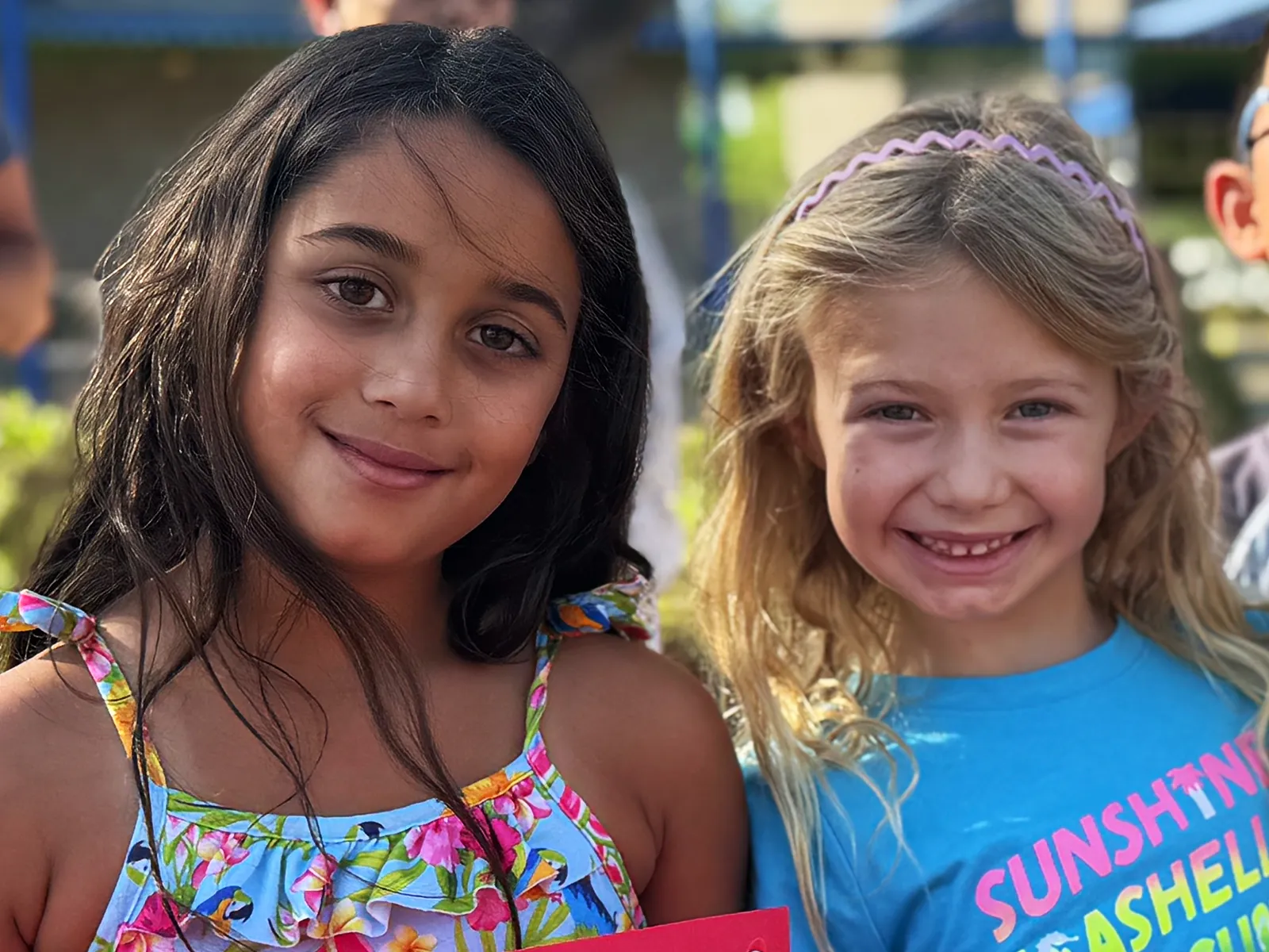 Summit School students smiling together on campus.