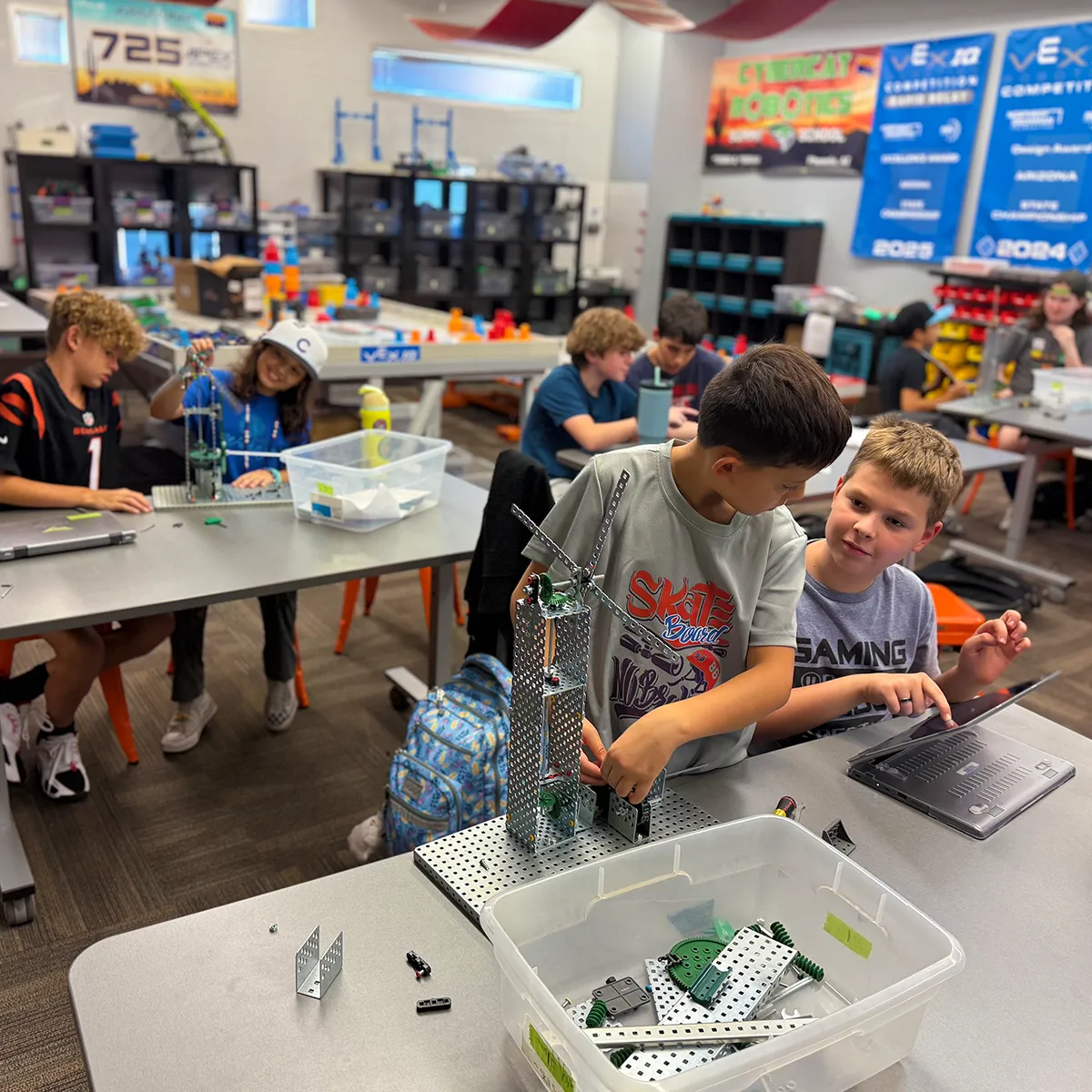 Summit School students collaborate on building and programming robots during a hands-on robotics class.